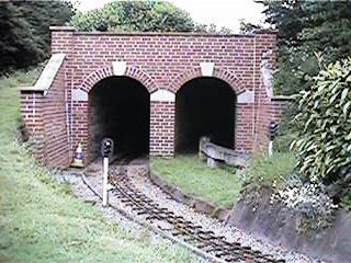 Dual entrance train tunnels